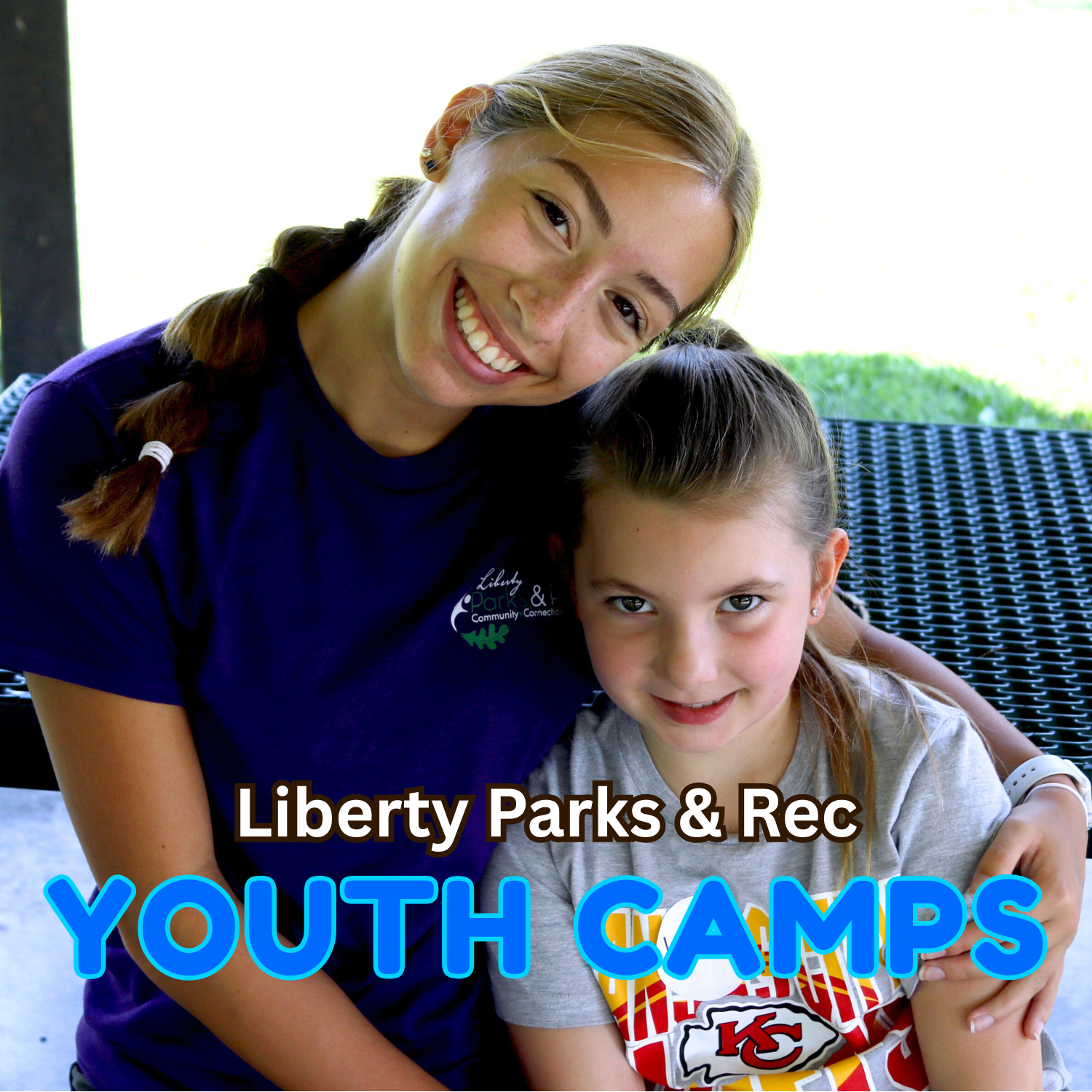 Camp worker pictured smiling with youth camp goer