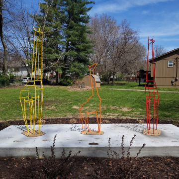 Photo of three giraffe sculptures titled "Feral Giraffe"