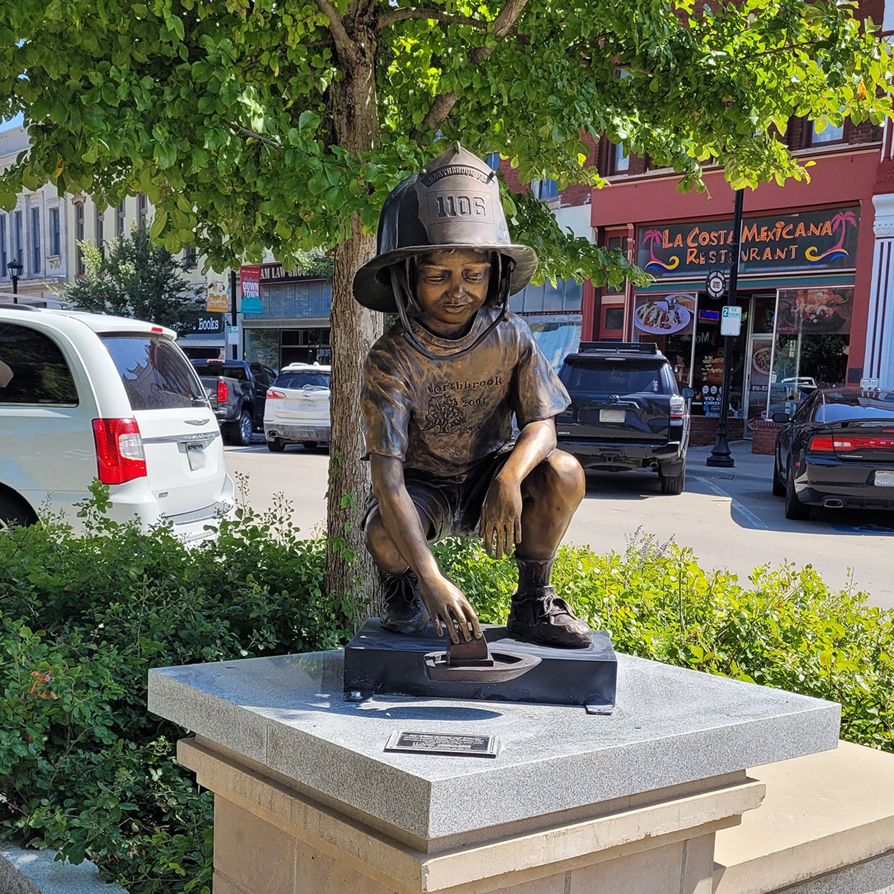 Photo of James Haire's sculpture \"In the Line of Duty\" located at the corner of Kansas St &