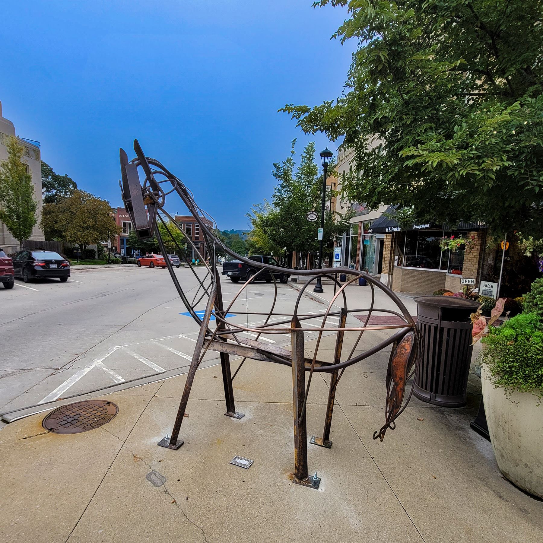 Photo of a sculpture named \"Yes Ma'am\" on the corner of Franklin and Water Streets