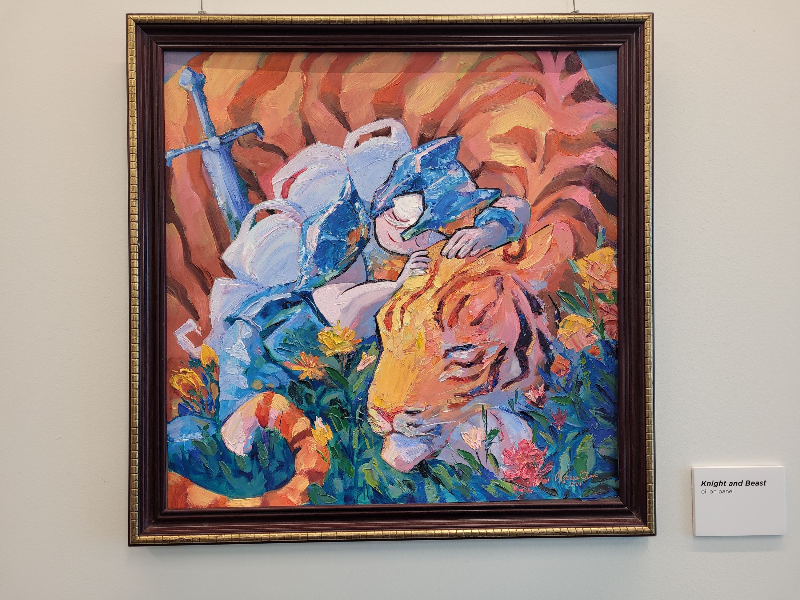 Artwork by Rebecca Owens depicting a knight hugging a tiger